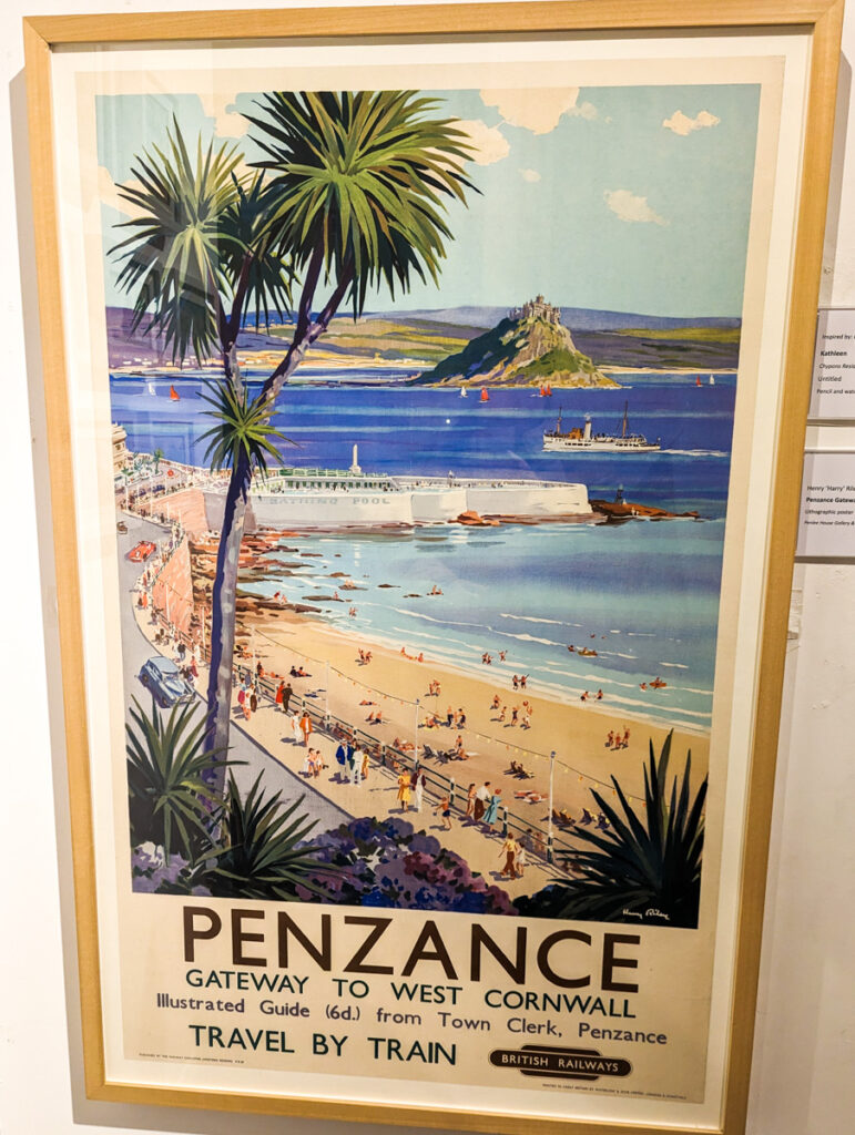 Poster of Penzance that dates back to the first tourism boom, with a view over Mount's Bay and a palm tree in the foreground.