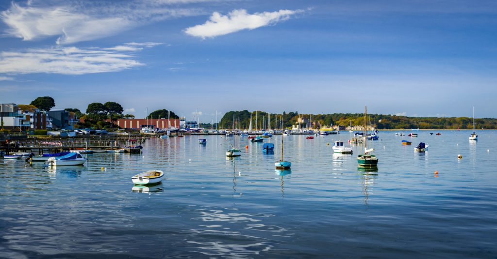 Leisure and fishing boats in Poole Harbour in Dorset, looking out to Brownsea Island from Sandbanks