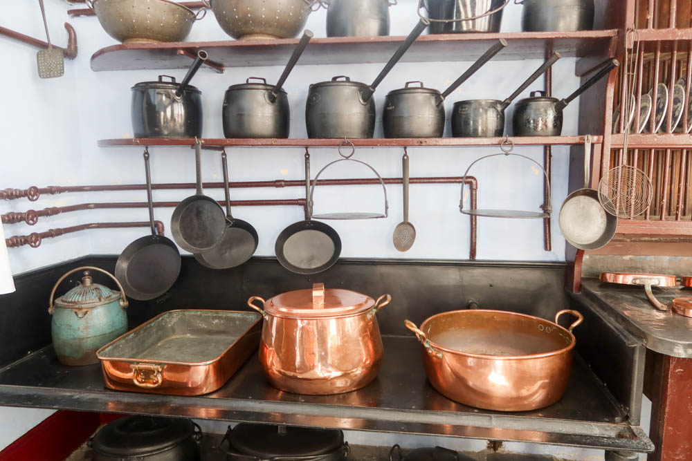 Victorian-era copper pots and pans on a stove