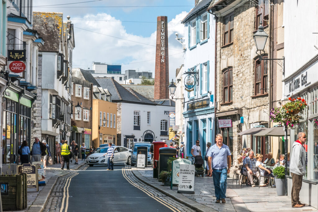 Plymouth, United Kingdom - August 27, 2015: Tourists walk along Southside Street in the Barbican, Plymouth, UK,