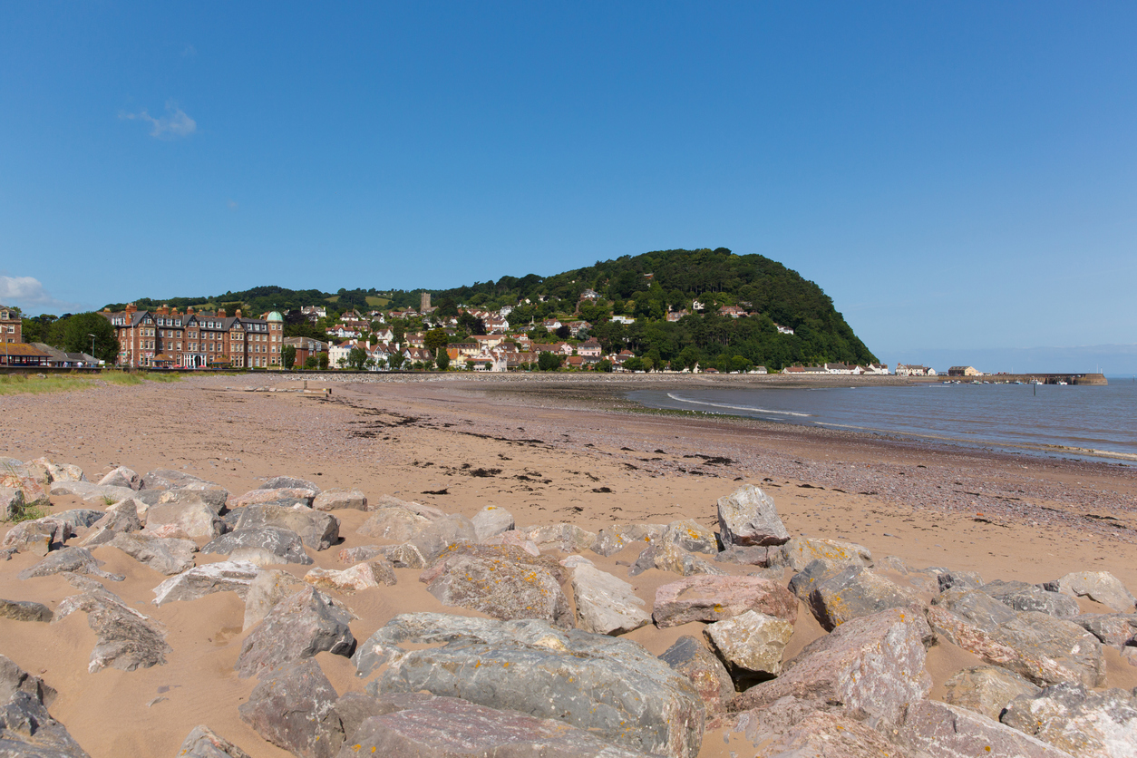 Minehead Somerset England UK beach and seafront towards the harbour in summer with blue sky on a beautiful day