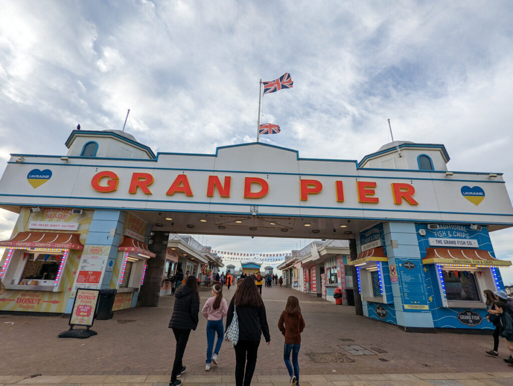People walking into the Grand Pier at Weston Super Mare