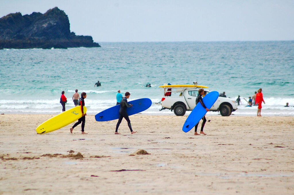 "Newquay, Cornwall, UK - August 11, 2010: Surfers on Fistral Beach, Newquay"