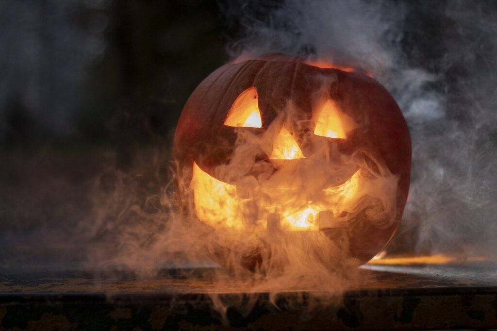 Spooky halloween pumpkin face covered in mist