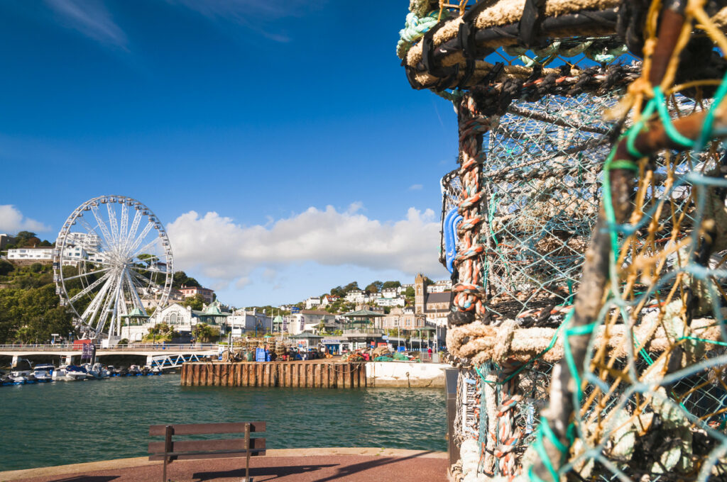 Lobster pots and the Torquay Wheel from the harbour