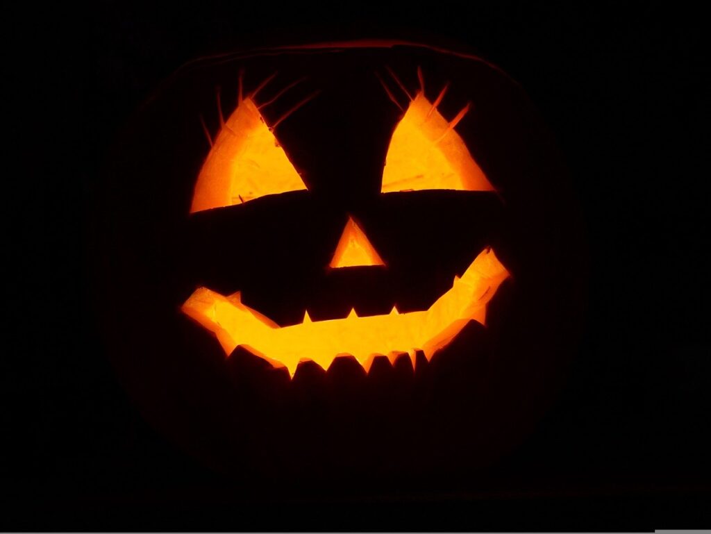 grinning pumpkin smiley face in the dark