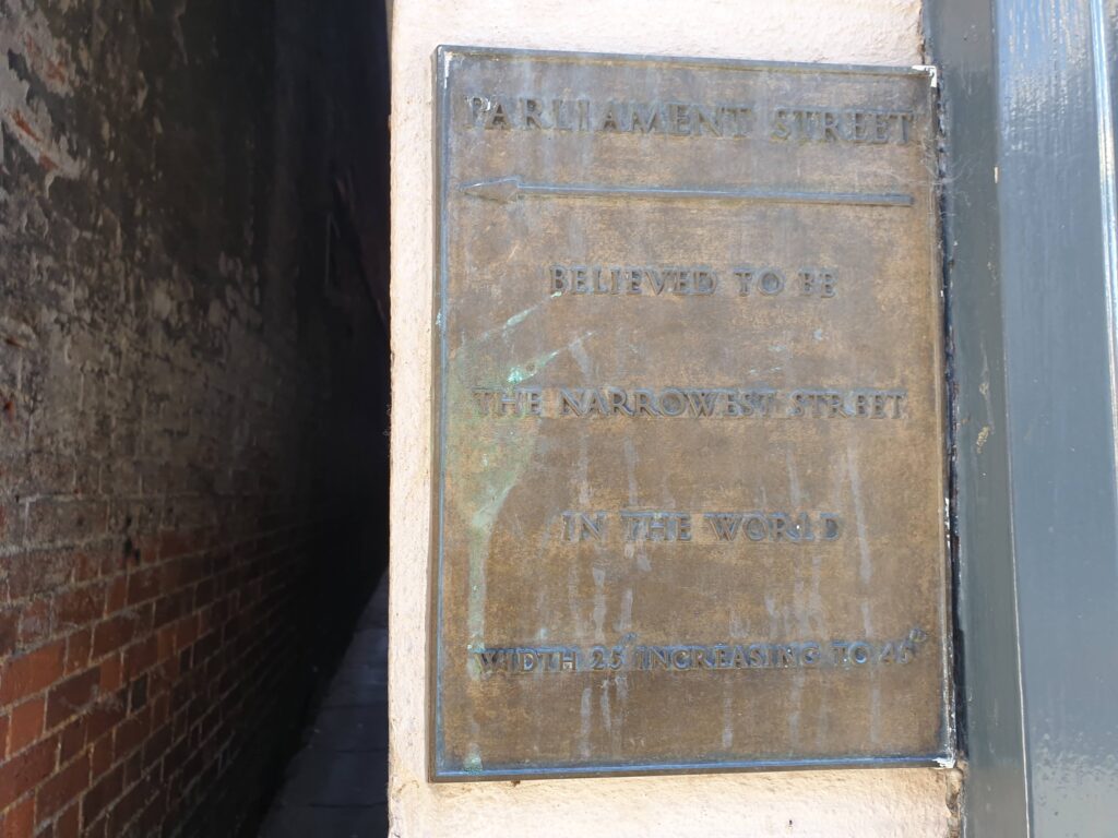 A plaque commemorating Parliament Street which is believed to be the narrowest street in the world