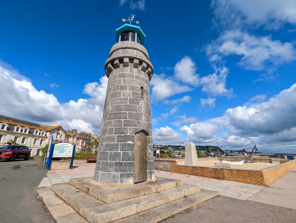 Teignmouth lighthouse, small lighthouse with a blue top and a cloudy sky in the background. 