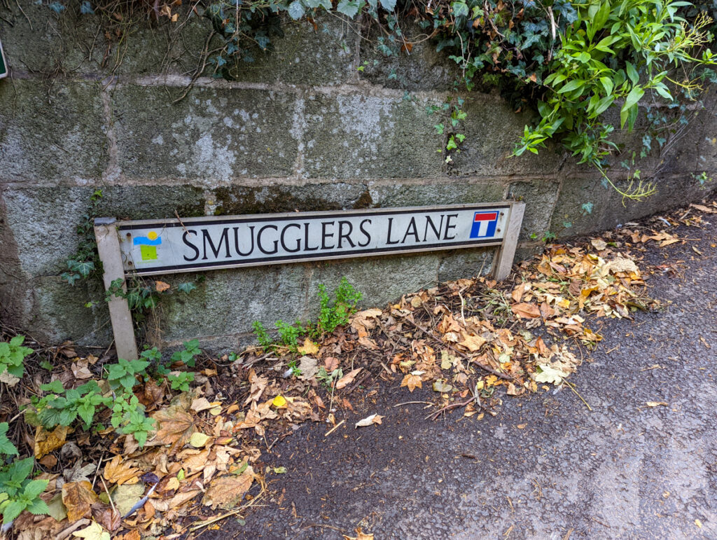 A road sign indicating Smuggler's Lane