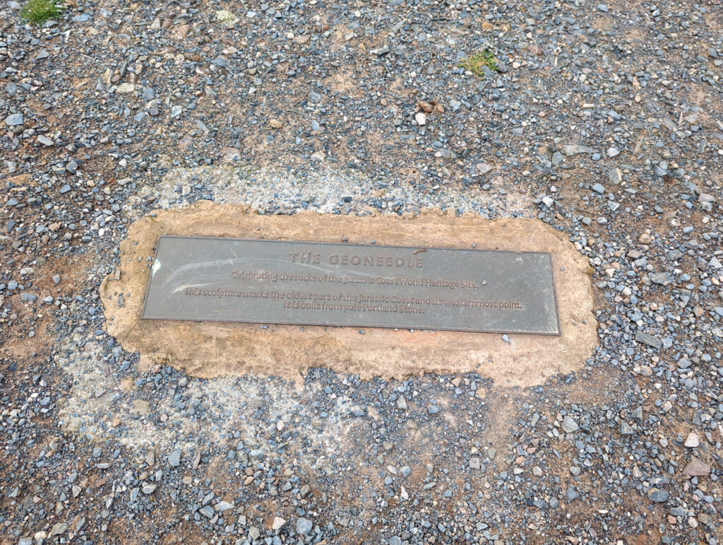 Sign on the floor about the Geoneedle at Orcombe Point Point