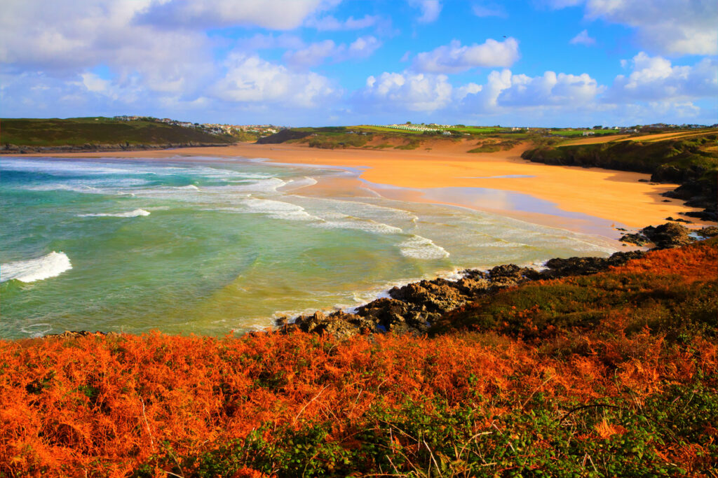 Beautiful colourful autumn colours English beach and coast Crantock bay North Cornwall England UK