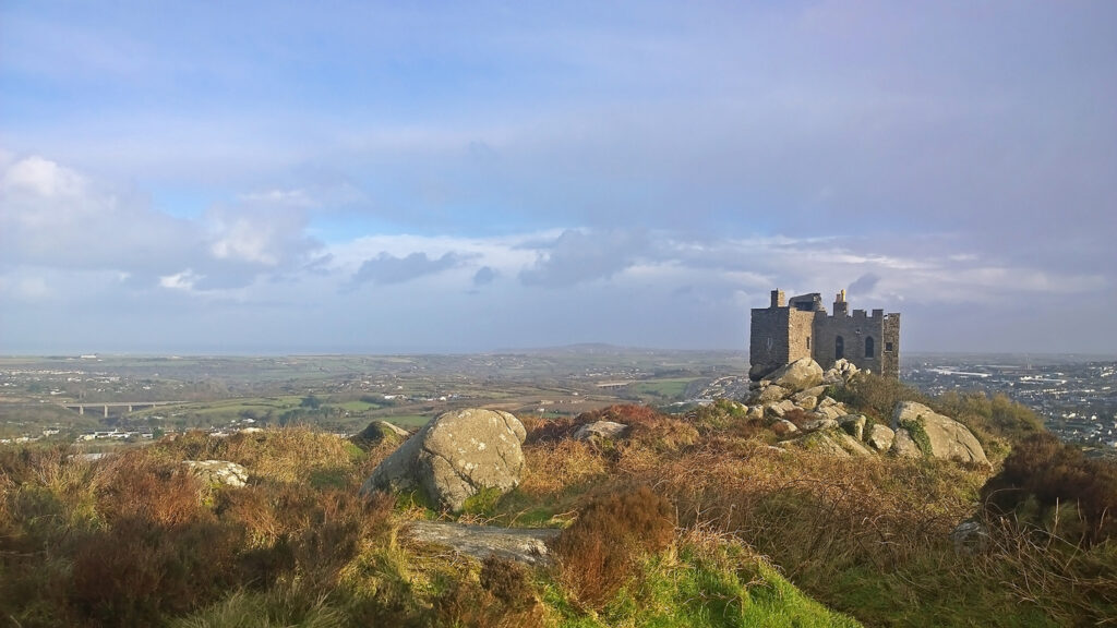 Red Redruth, Cornwall, UK -  February  9, 2014: Showing the Carn Brea Castle on top of a hill by Redruth
