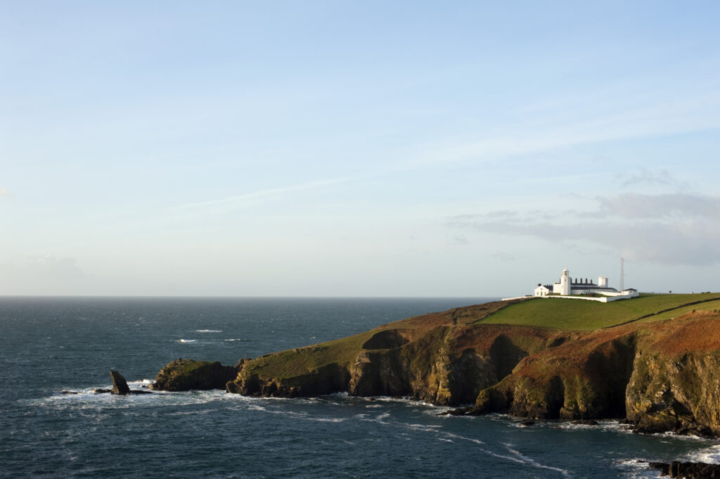 Scenic view of the coastline at Lizard Point, Lizard Peninsula, Cornwall with its historic lighthouse which marks the southernmost point in England overlooking the English Channel