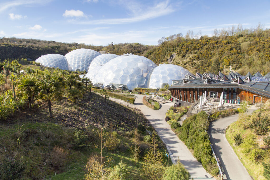 St Austell, Cornwall, United Kingdom: April 13, 2016: View of the biomes at the Eden Project. Inside the biomes, plants from many diverse climates and environments have been collected and are displayed to visitors. The Eden Project is located in a reclaimed Kaolinite pit, located about 5 kilometres from the town of St Austell, Cornwall in England.