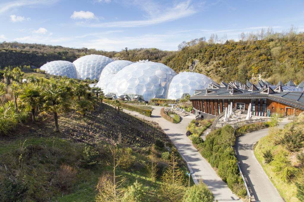 St Austell, Cornwall, United Kingdom:  April 13, 2016: View of the biomes at the Eden Project. Inside the biomes, plants from many diverse climates and environments have been collected and are displayed to visitors. The Eden Project is located in a reclaimed Kaolinite pit, located about 5 kilometres from the town of St Austell, Cornwall in England.