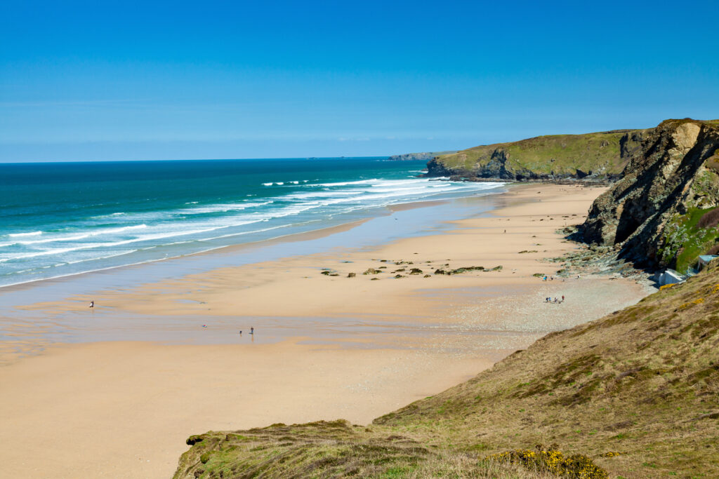 On the coast path overlooking the golden sandy beach at Watergate Bay near Newquay Cornwall England UK Europe