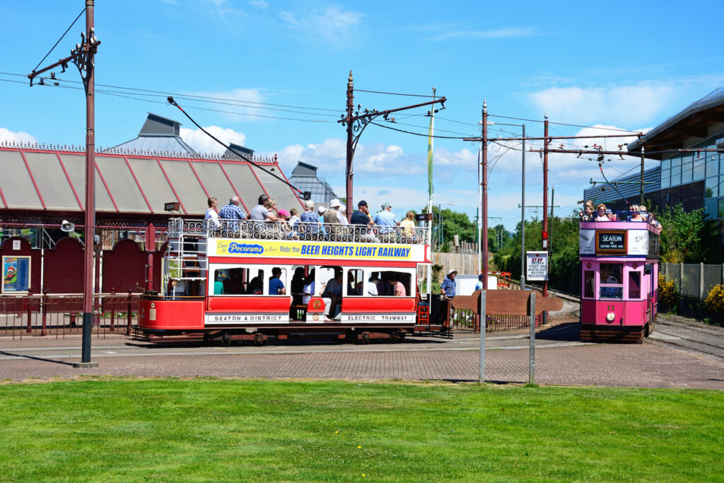 Seaton, United Kingdom - July 18, 2016: View of Seaton Electric Tramway Trams outside the tram station with people enjoying the setting, Seaton, Devon, England, UK, Western Europe.