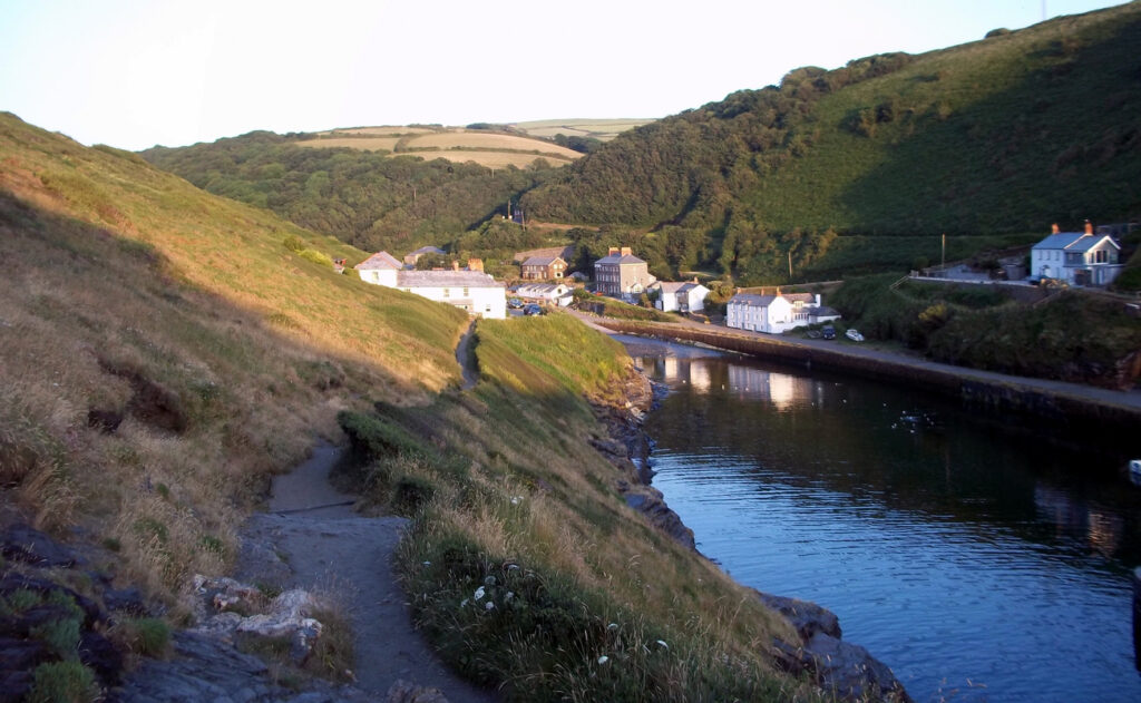 From the cliffs alongside the harbour the path leads back to Boscastle.  Showing the evening sunset and the reflection in the sea.