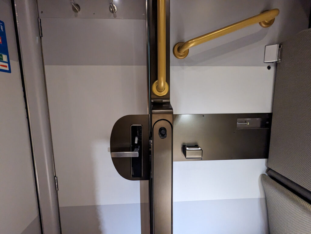 The door of the GWR sleeper cabin with a handle to get to the upper bunk. 
