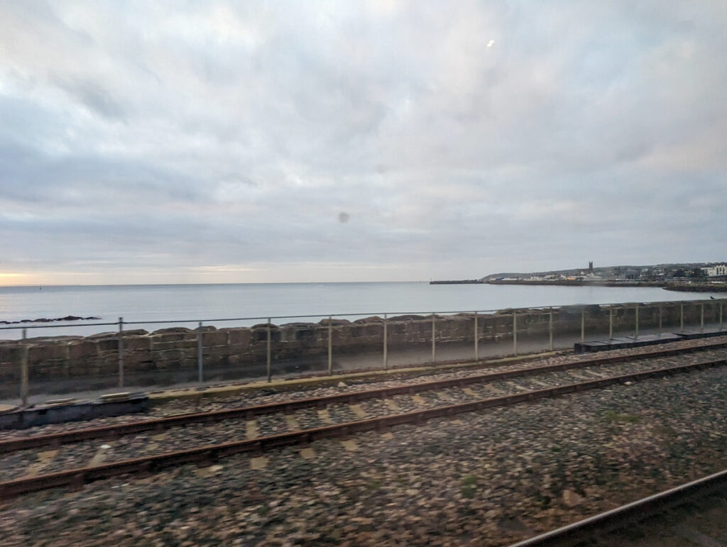 Pulling into Penzance station on the Night Riviera Sleeper, with views of the rails and Mount's Bay