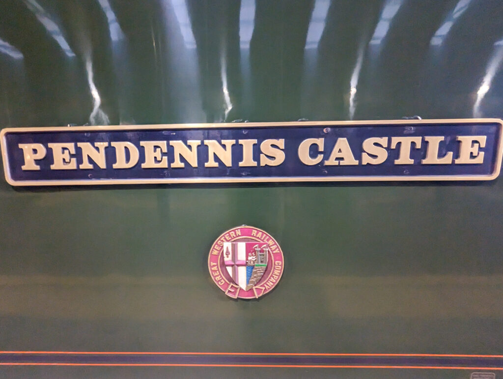 A sign saying Pendennis Castle on the side of the night train to Cornwall.