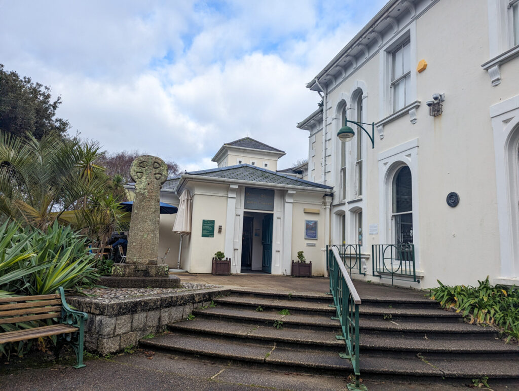 Penlee House Museum and Gallery, a white building which is where artworks and historical artefacts are displayed. It's a white building with steps leading up to it.