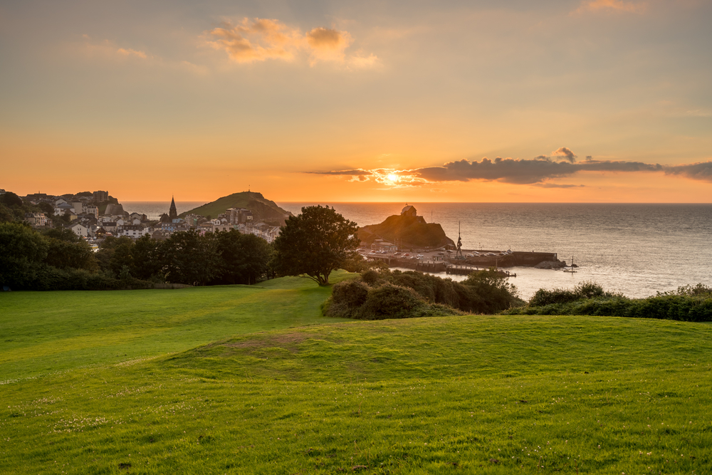 Panorama of the seaside town of Ilfracombe in Devon at sunset with view over harbor and houses