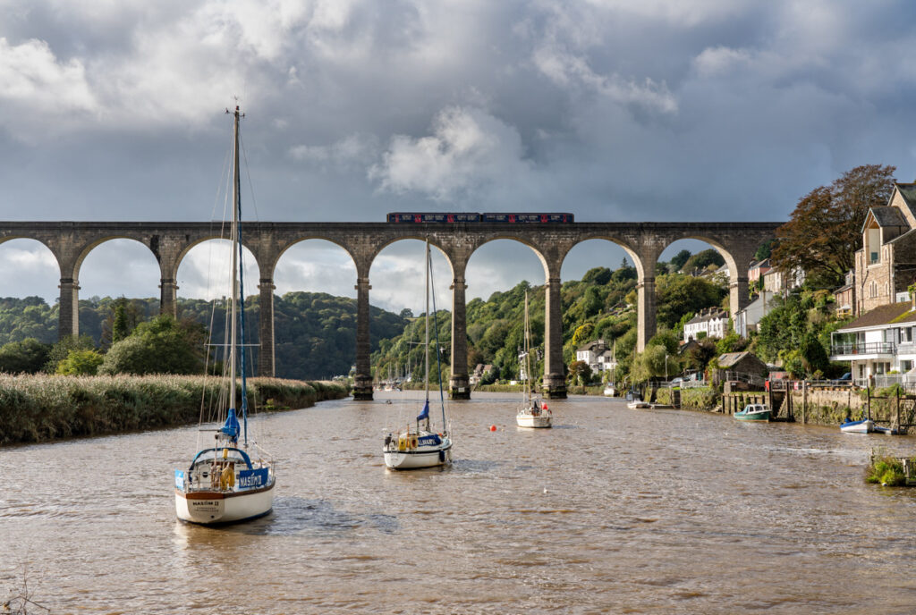 Calstock, UK - 29 September 2019: GWR train on the viaduct over River Tamar by Calstock on the border of Devon and Cornwall