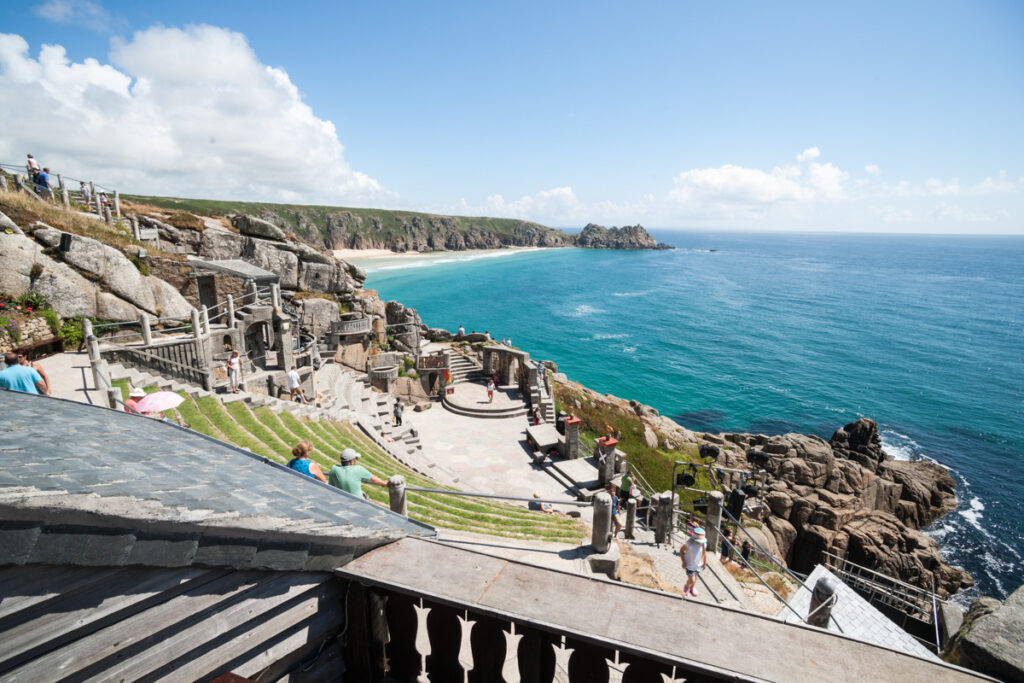 The minack theatre, overlooking the bright blue water at Porthcurno Beach