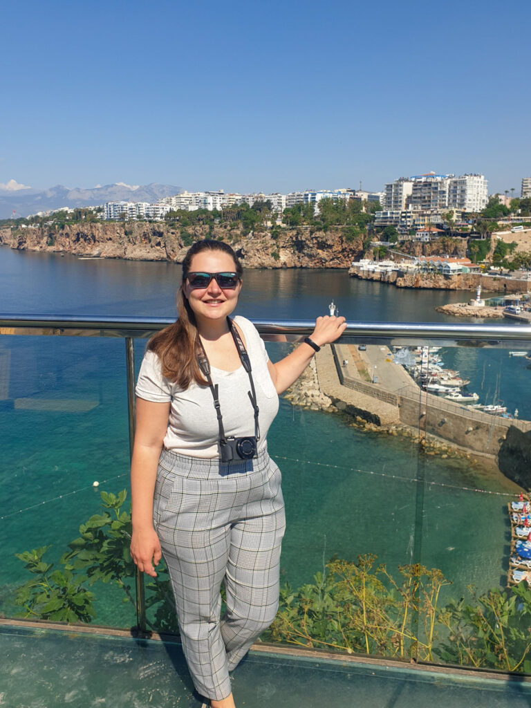 Standing in front of historic buildings of Antalya in Turkey