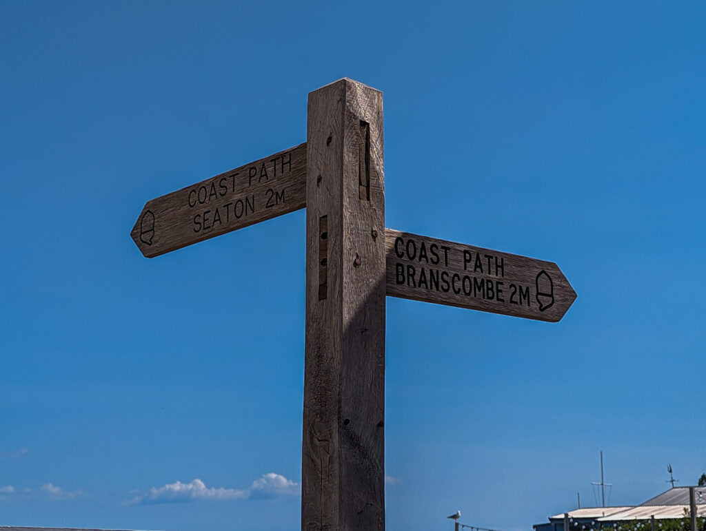 Sign leading to the coast path, Seaton one way and Branscombe the other way.