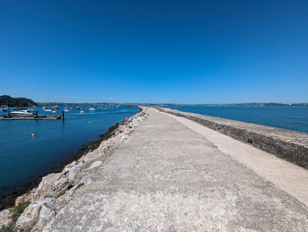Brixham breakwater spanning half a mile out into the sea.