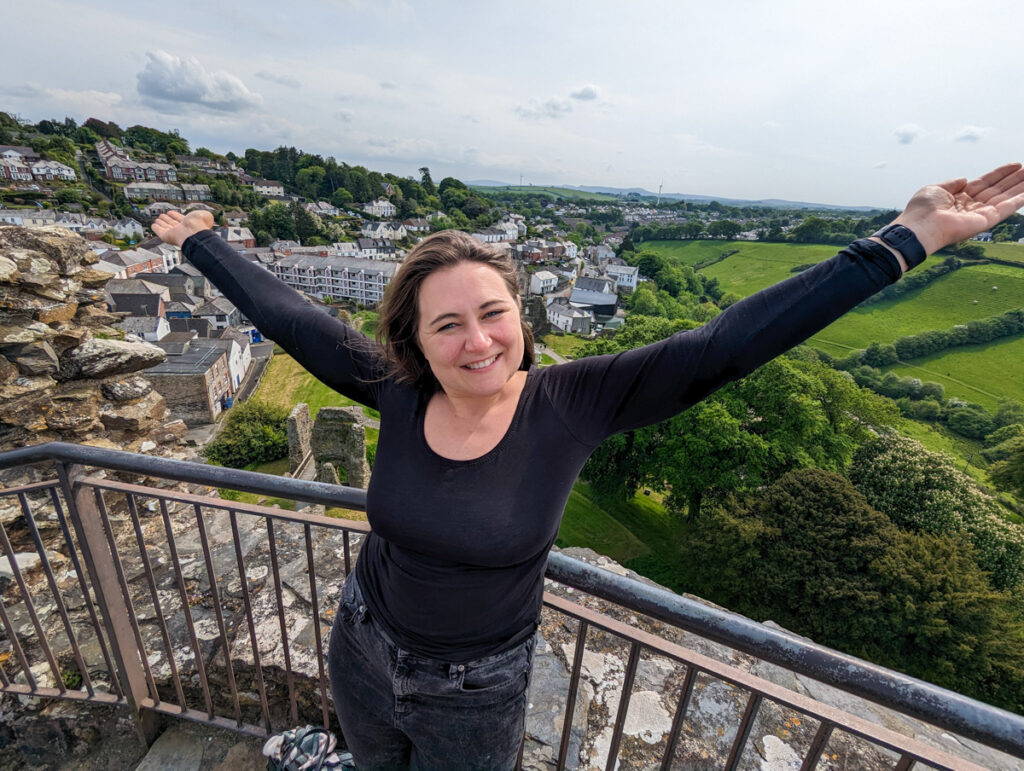 Claire at the top of Launceston Castle with views of Dartmoor and Bodmin Moor in the background. 