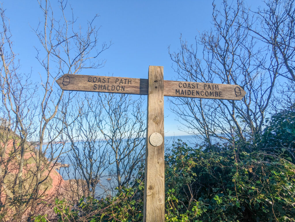 South West Coast Path sign with acorns