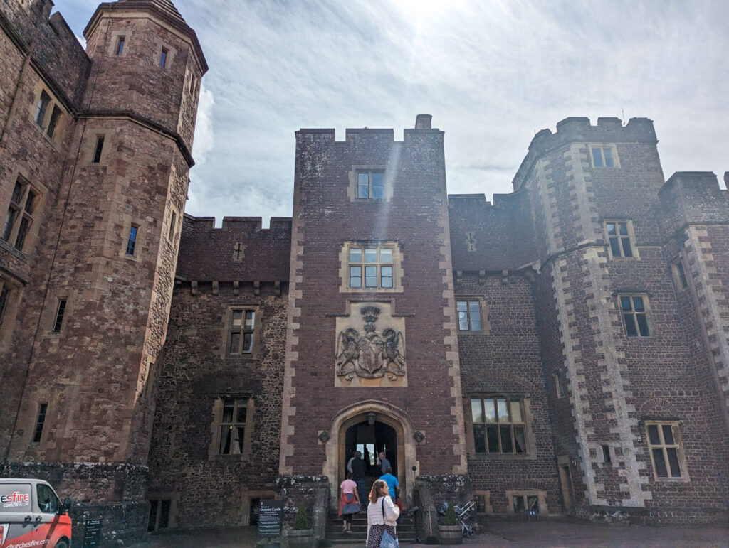 The outside of Dunster Castle on a warm summer's day. 