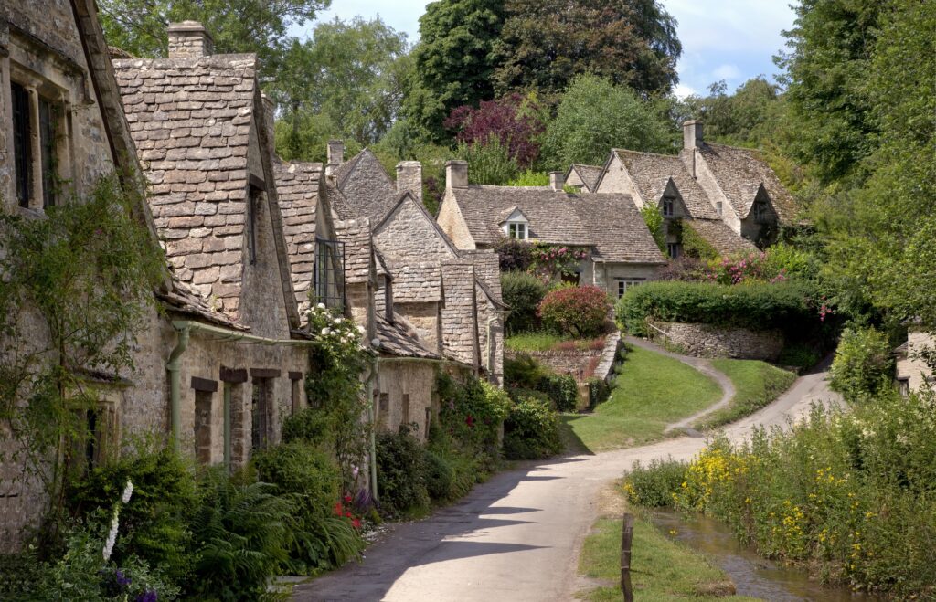 Arlington Row at the pretty Cotswold village of Bibury, Gloucestershire, England.